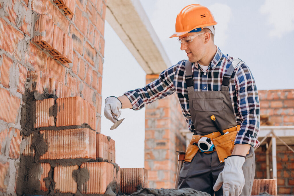 young craftsman building a house